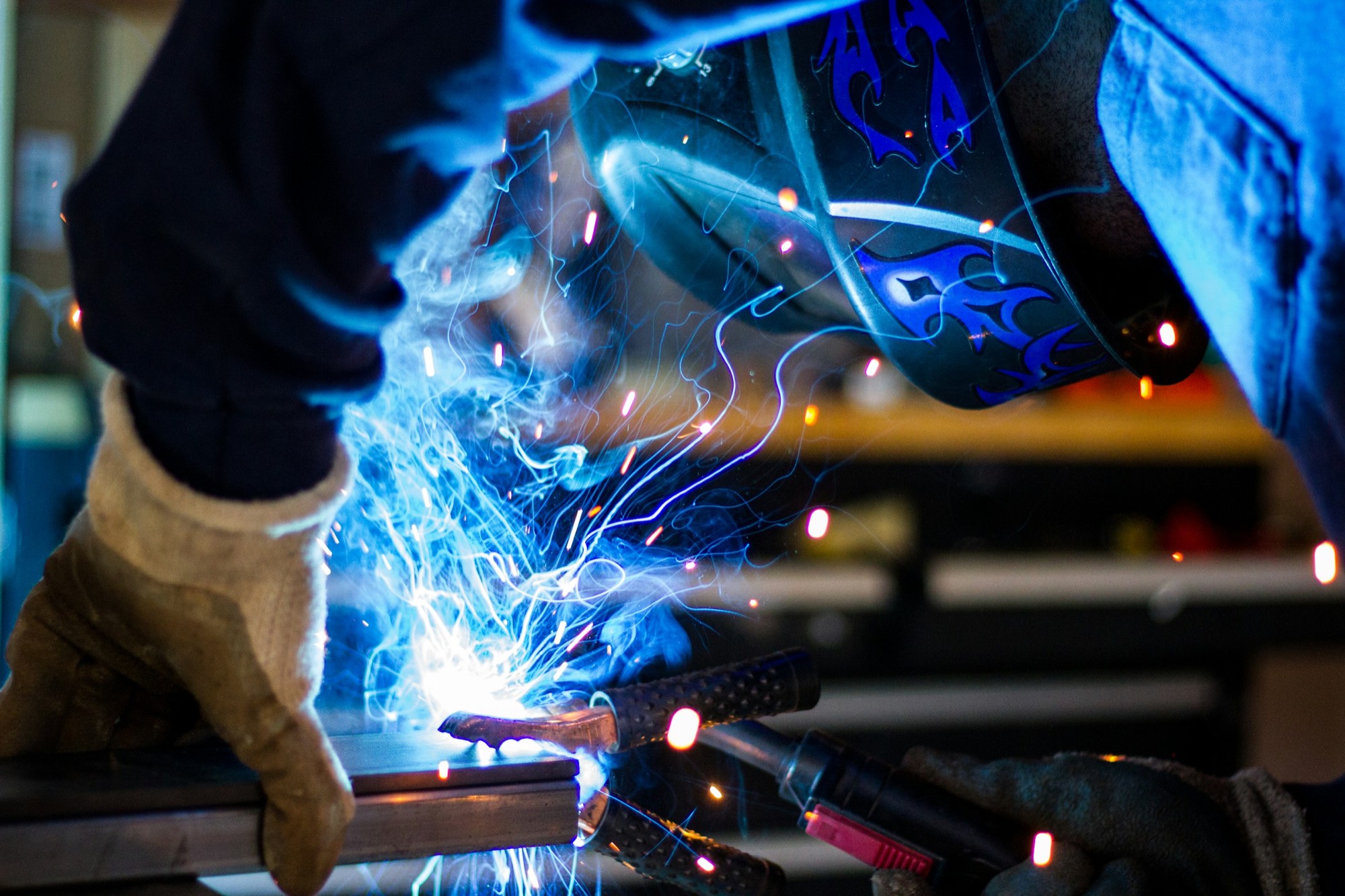 Welding arc and sparks in the fabrication shop